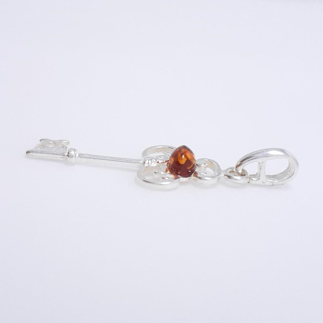DIJE LLAVE COGNAC